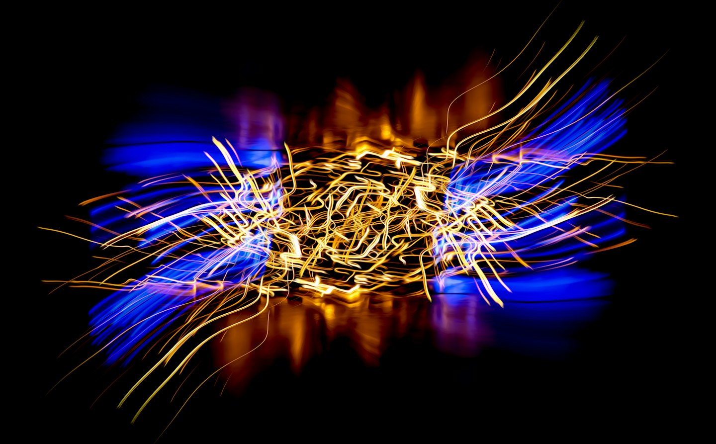 Glowing golden and blue light trails form a complex pattern.